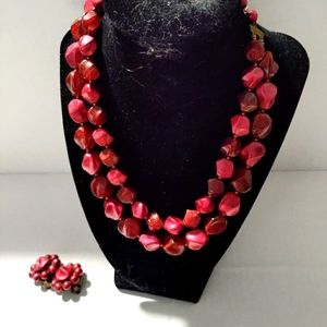 Vintage lucite or plastic necklace set .